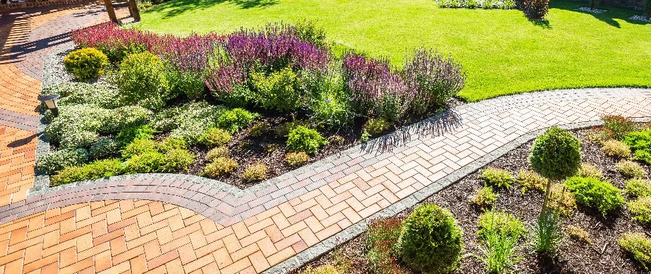 Paver walkway in Leola, PA, along a green lawn and landscape beds.