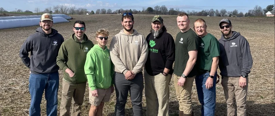 Team Photo Outdoors with Woolley Bros Lawn Care Hoodie Uniform